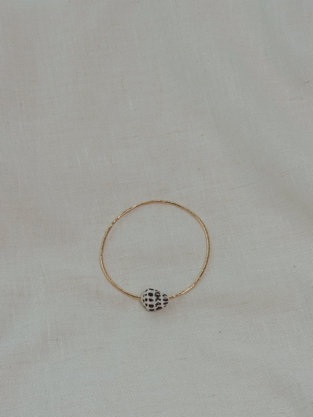 Gold Bangle with Hebrew Cone Shell