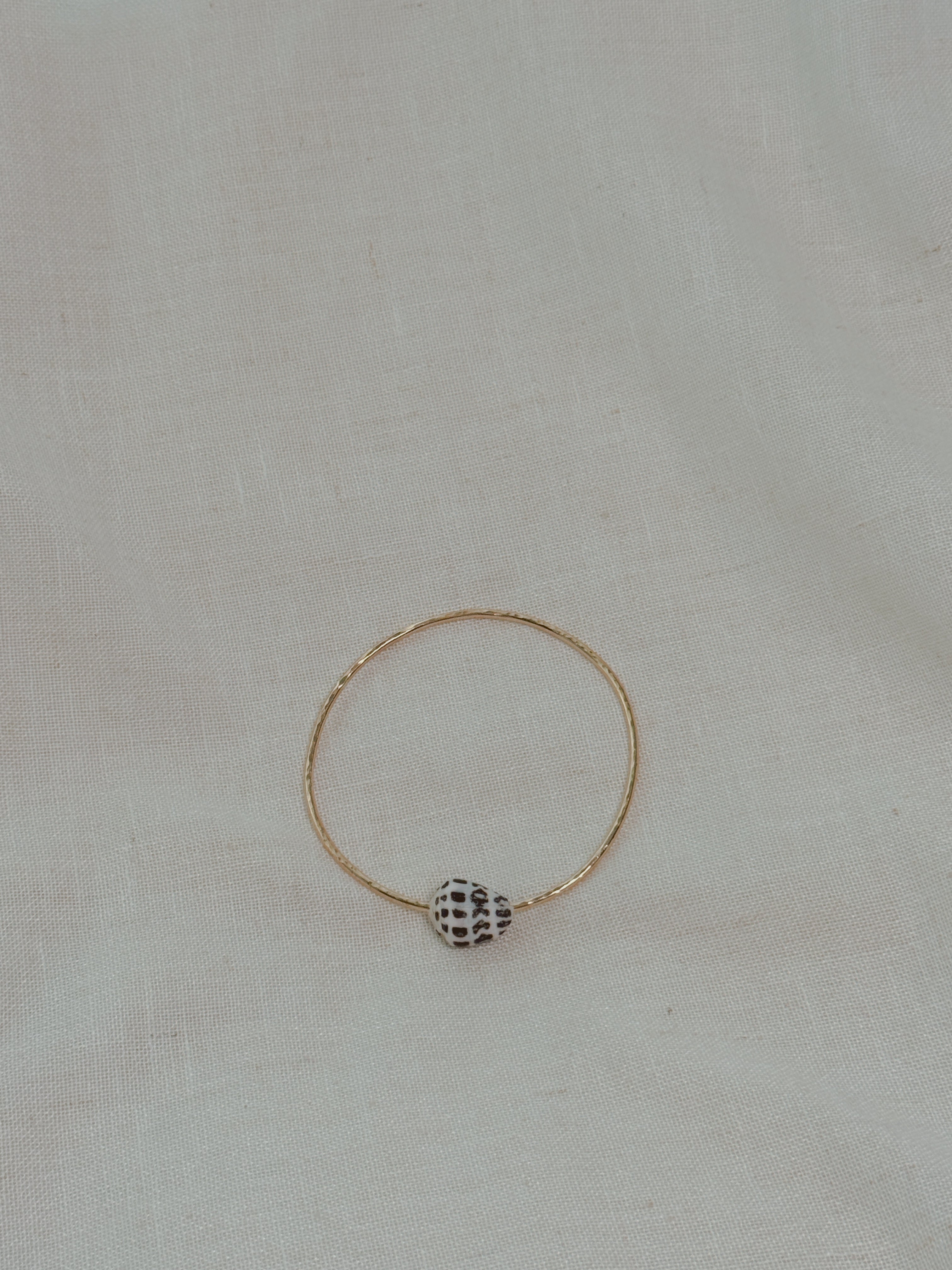Gold Bangle with Hebrew Cone Shell